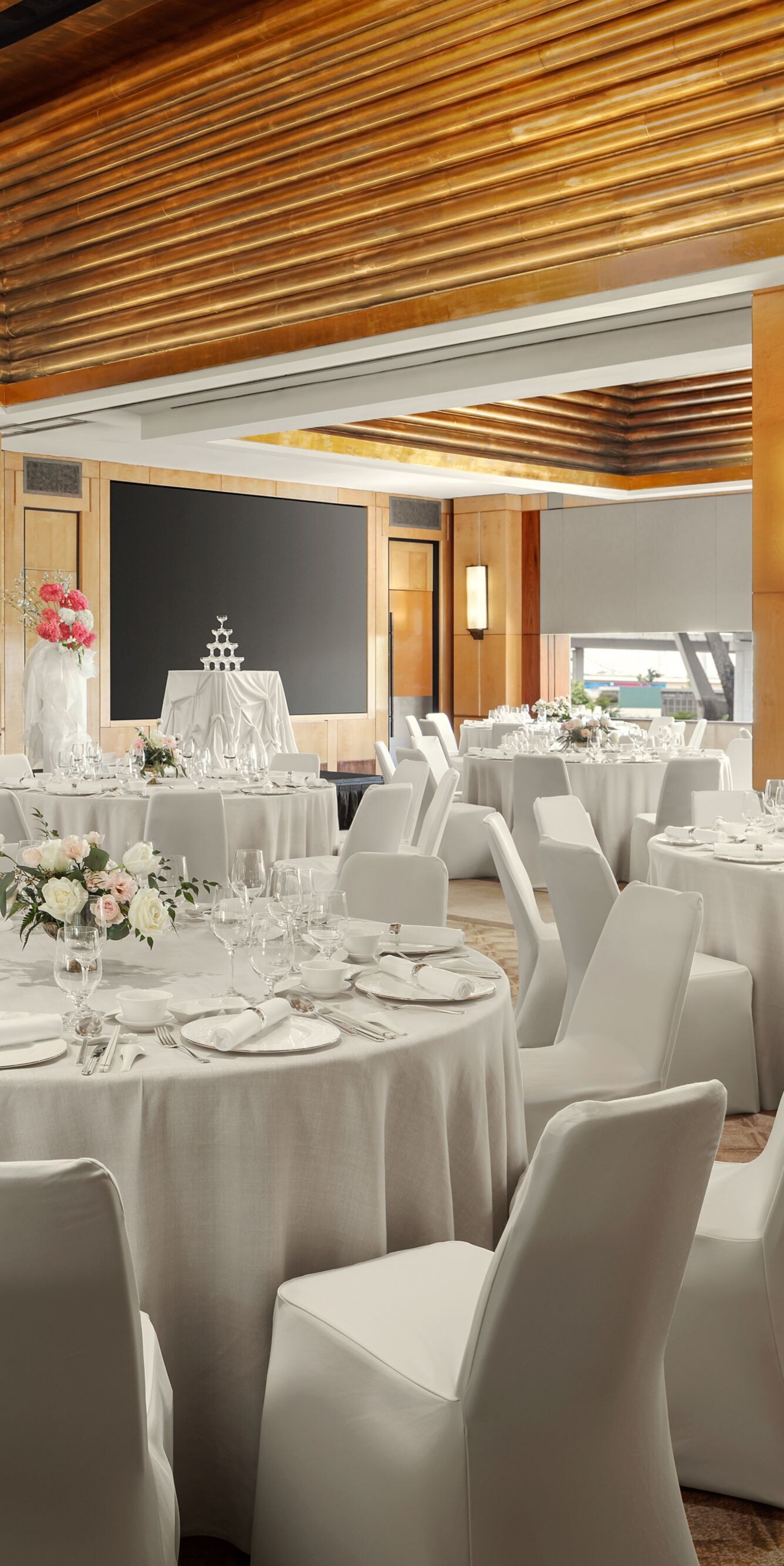 a ballroom with wedding banquet tables