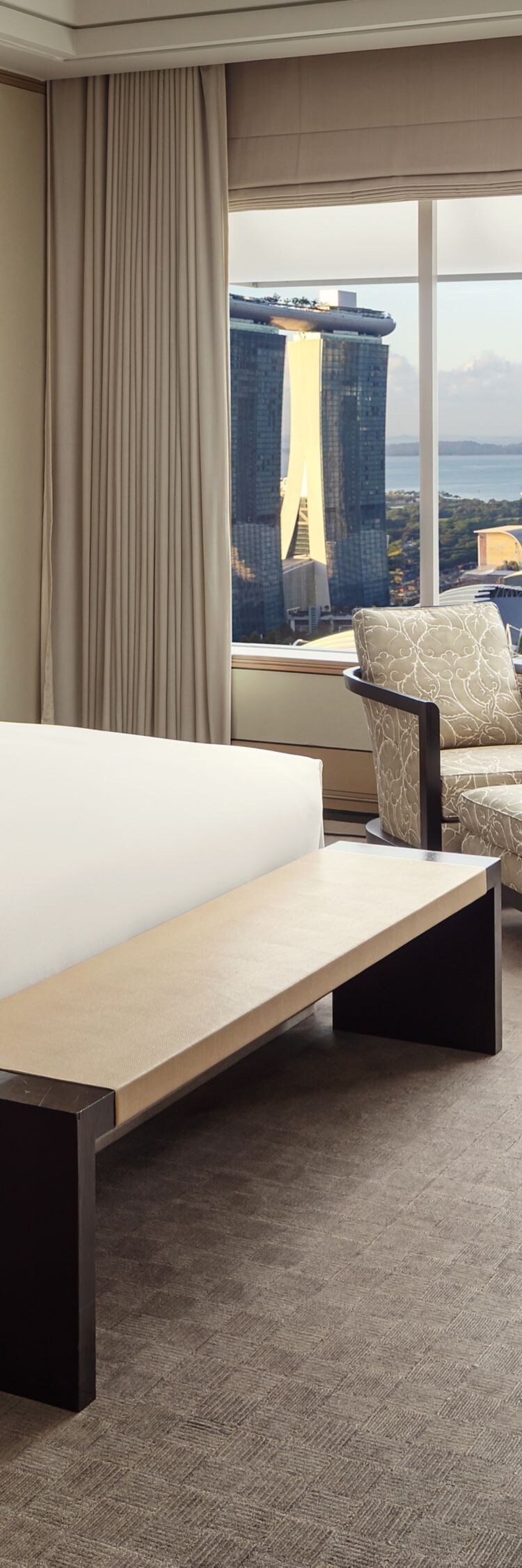bedroom with king bed overlooking marina bay