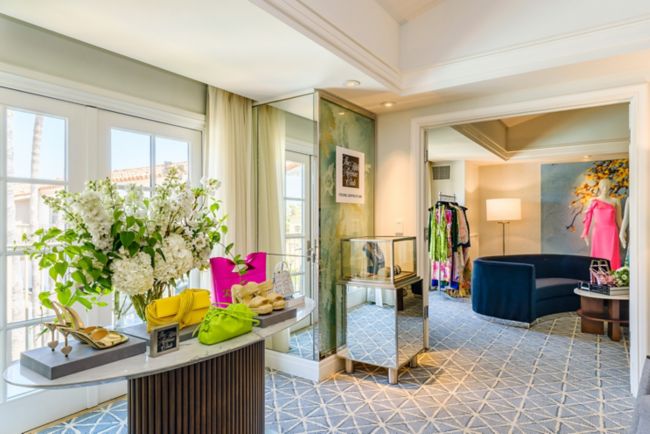 Room with luxury shoes, handbags and attire.