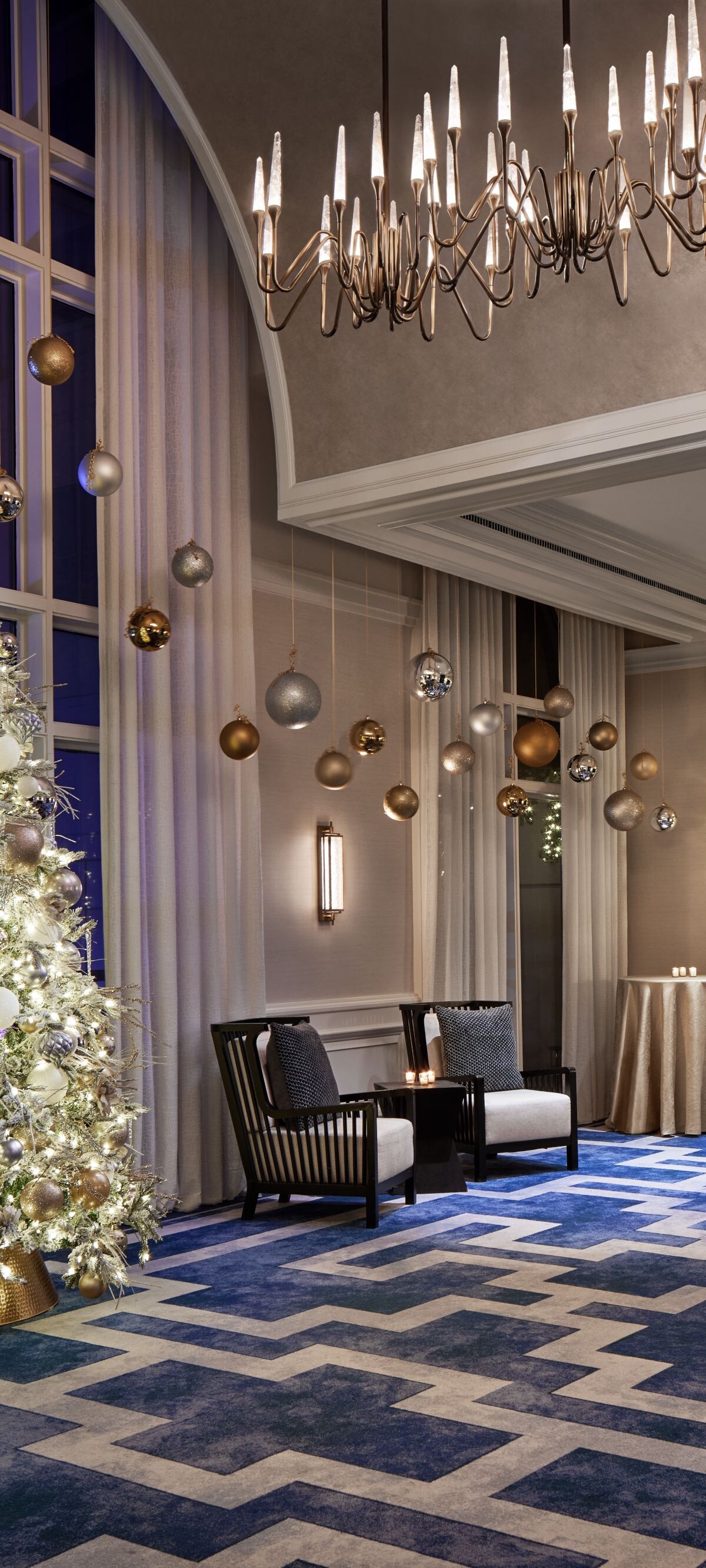 Holiday decorations and tree in ballroom foyer