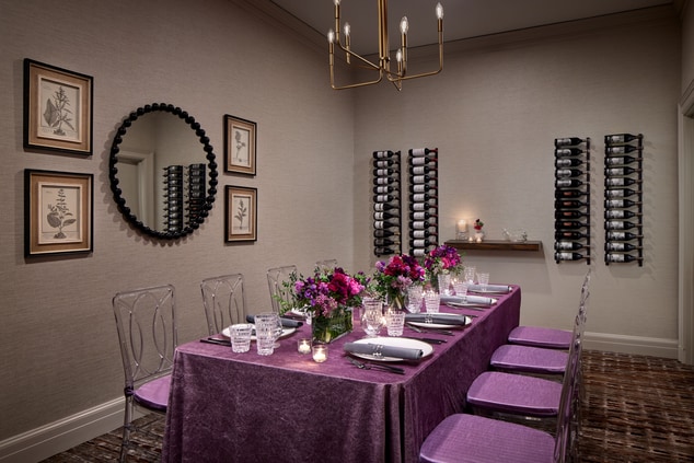 Room with table, chairs, tablescape, florals