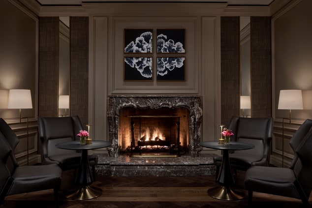 Fireplace with cozy seating in ENTYSE restaurant
