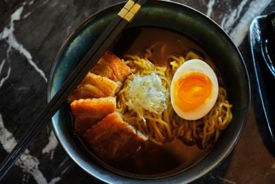 Bowl of ramen with noodles and egg.