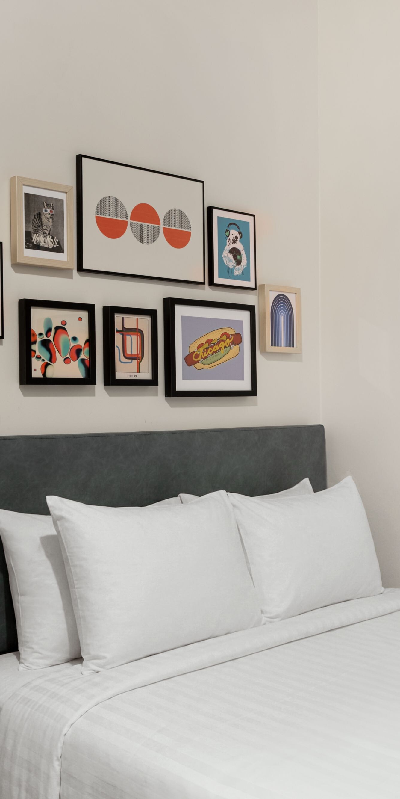 queen bed, artwork, and window