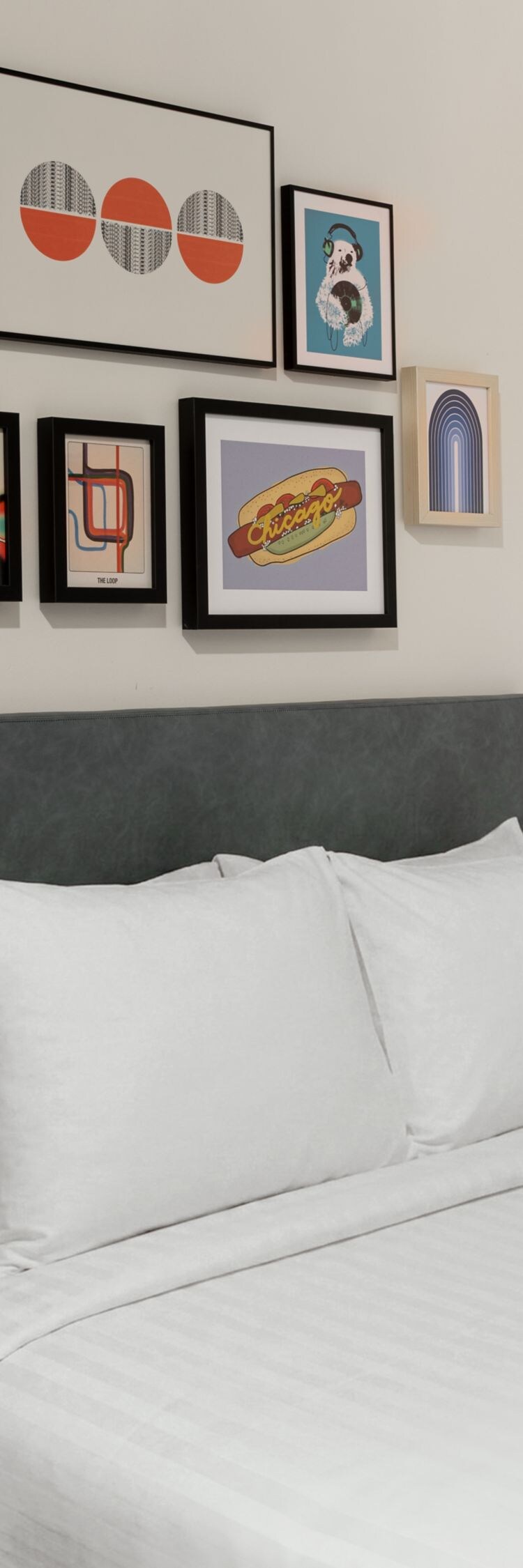 queen bed, artwork, and window