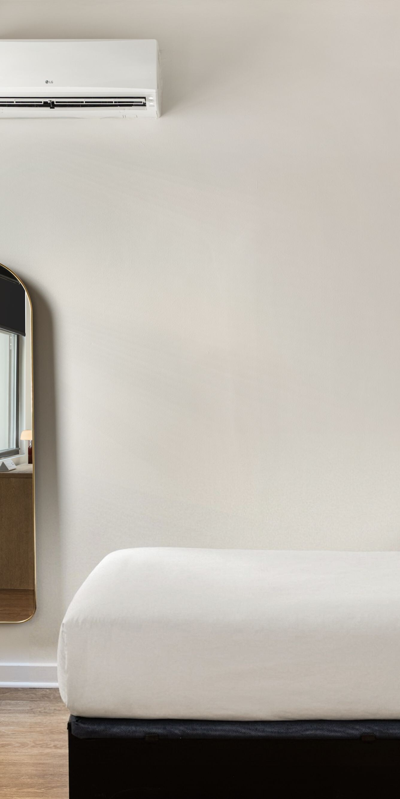 Cozy guest room with bed and framed artwork