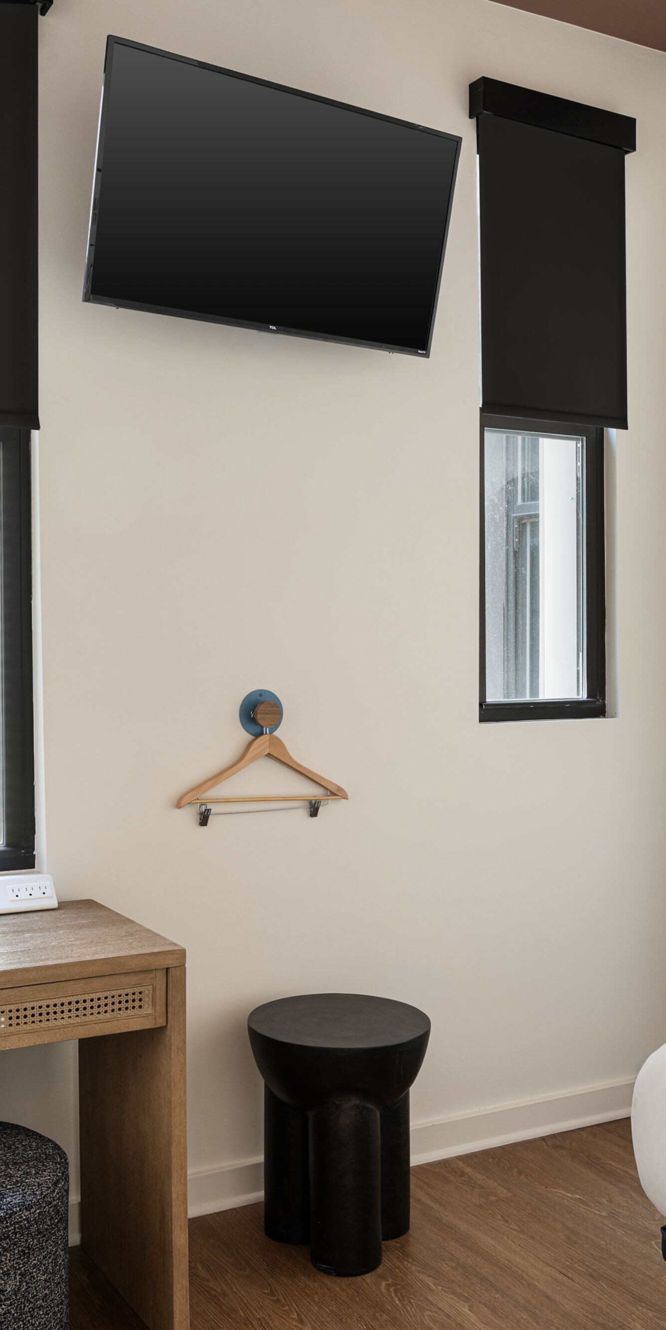 Guest room with bed, desk, mirror and TV