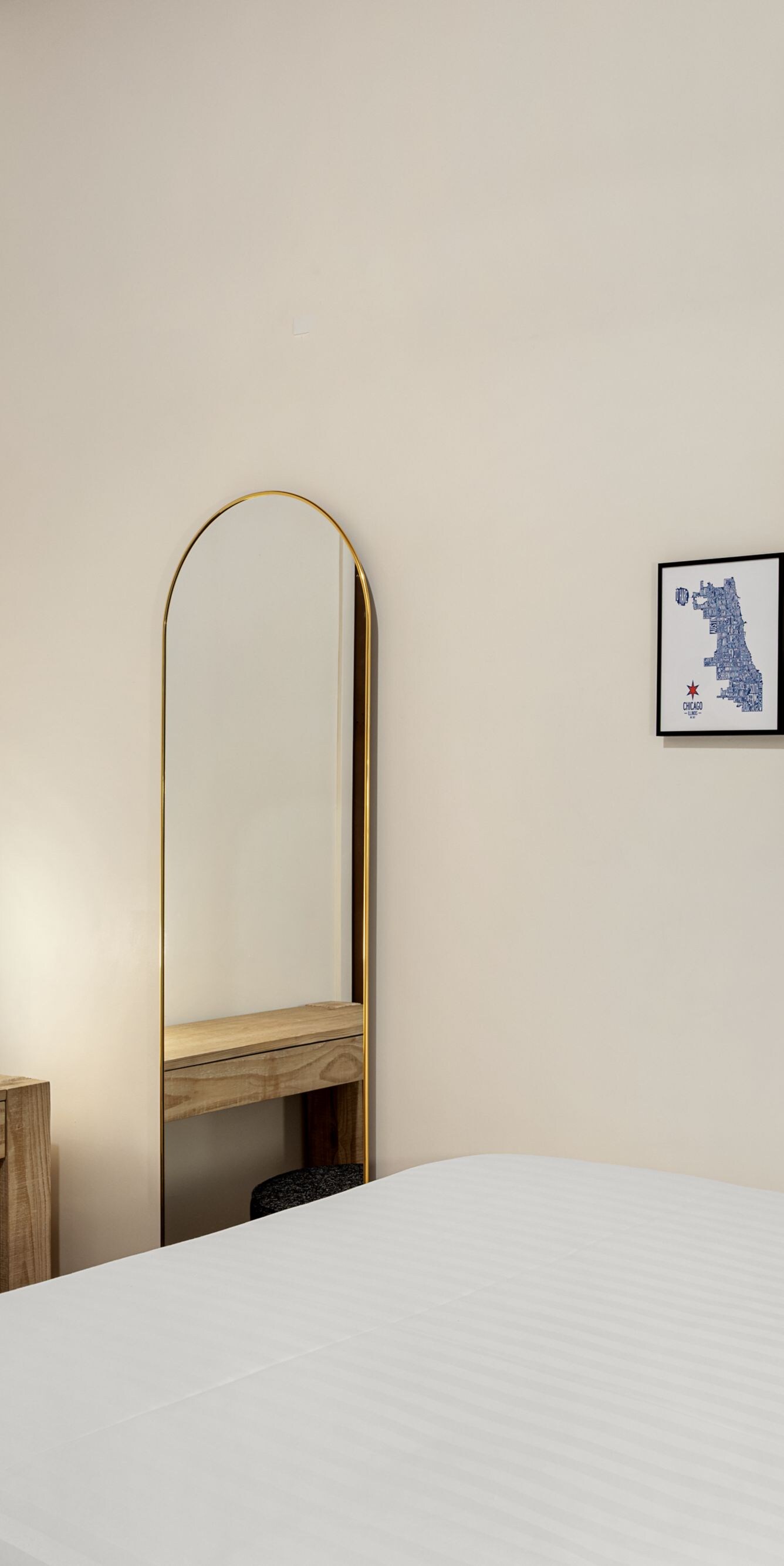 Studio guest room with bed and wall art