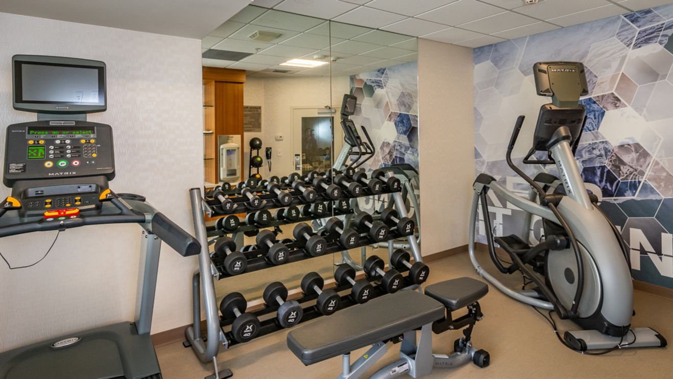 Fitness center with treadmill, elliptical, free we