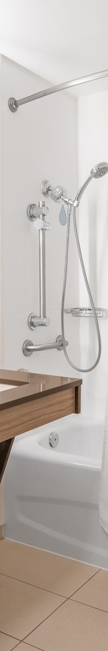 Accessible Shower/Tub Combo with bulk amenities.