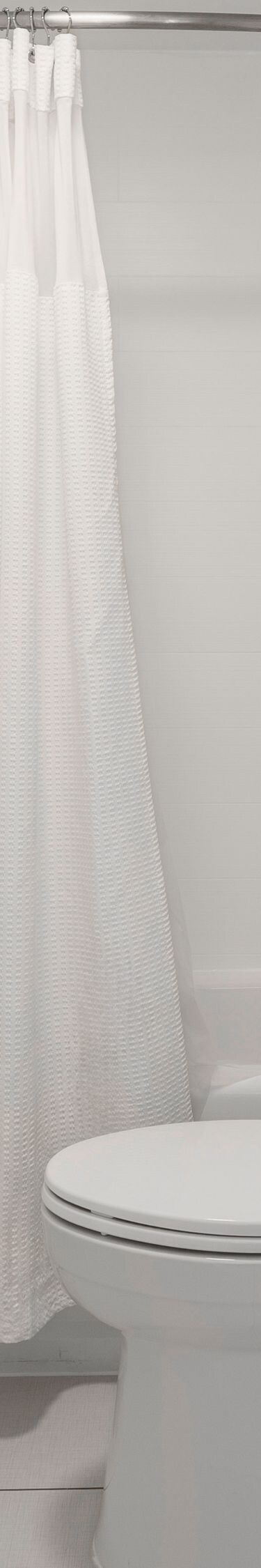 Shower/Tub combination with bulk shower amenities.