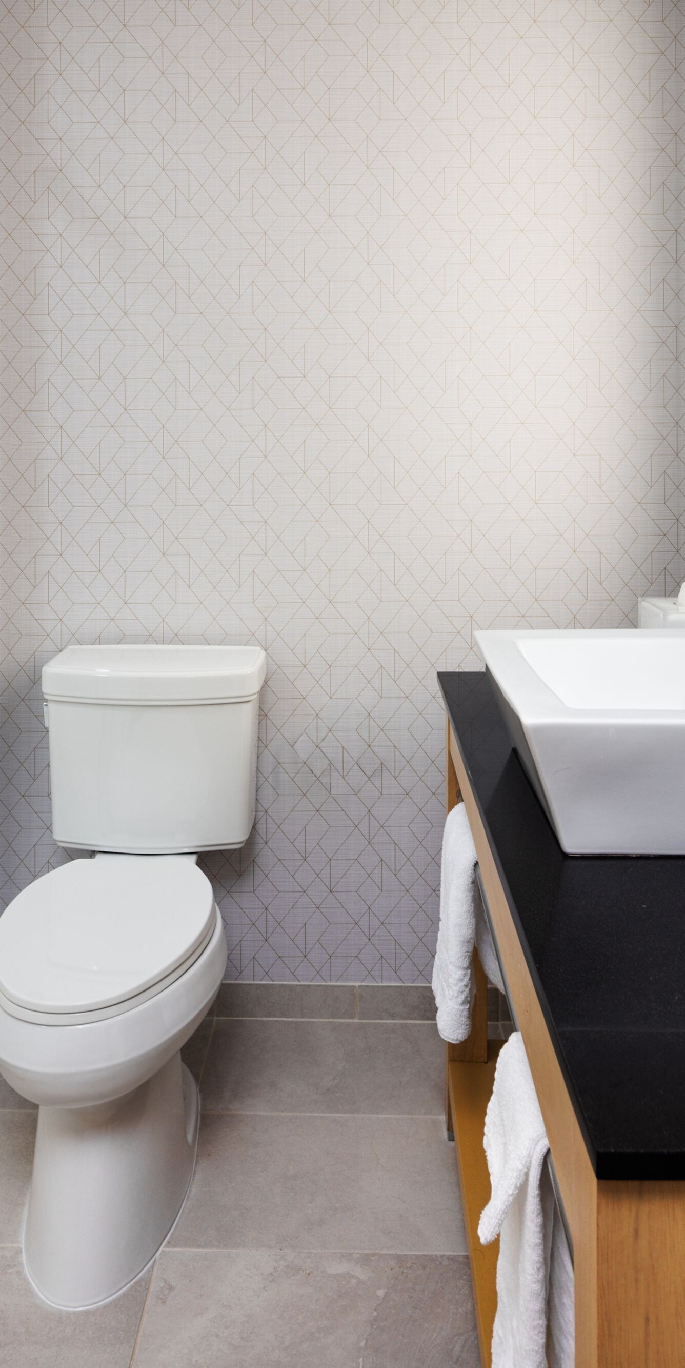 Walk-in shower, sink, toilet, lighted mirror