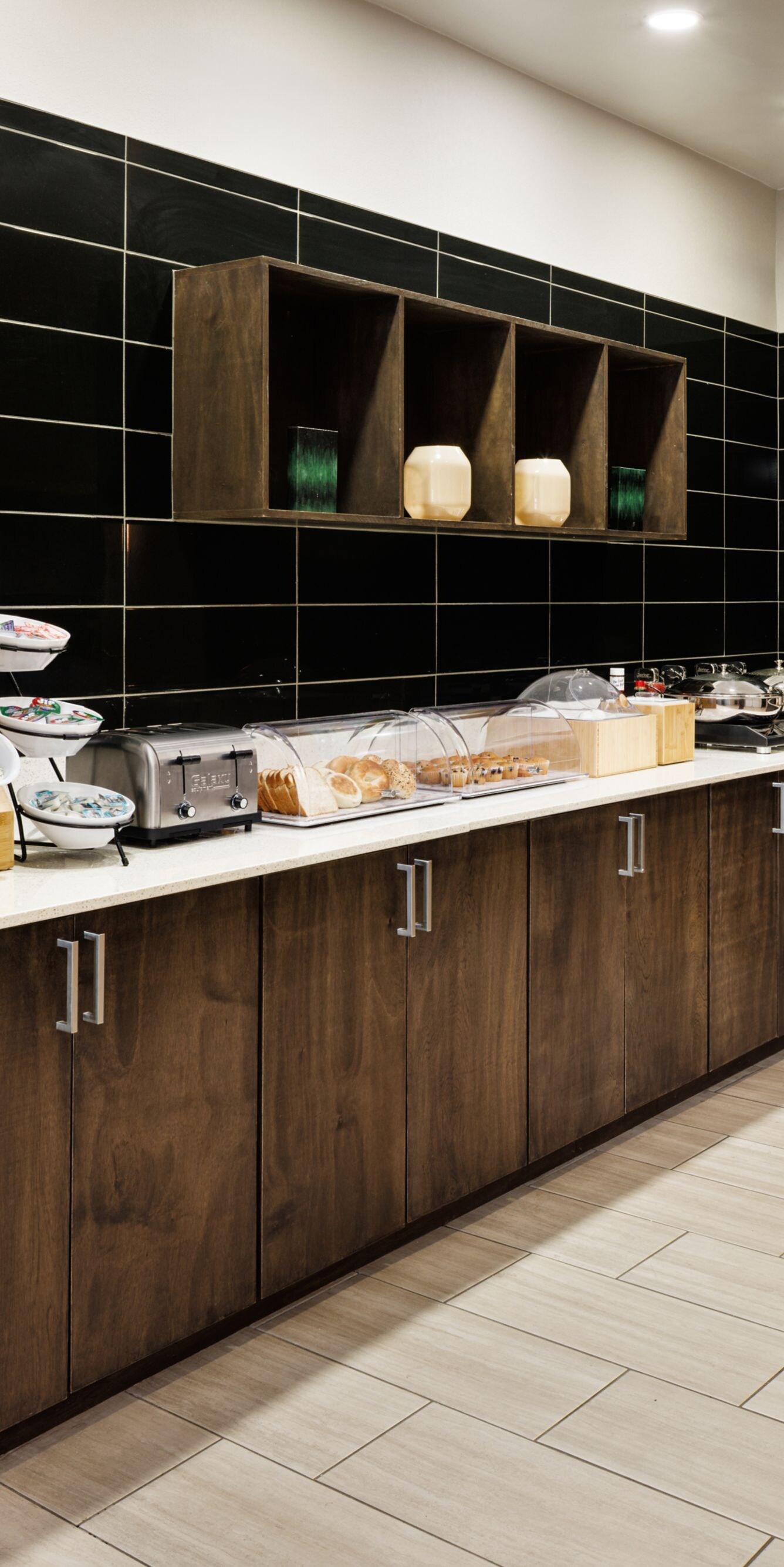 Breakfast buffet with dark wood cabinetry