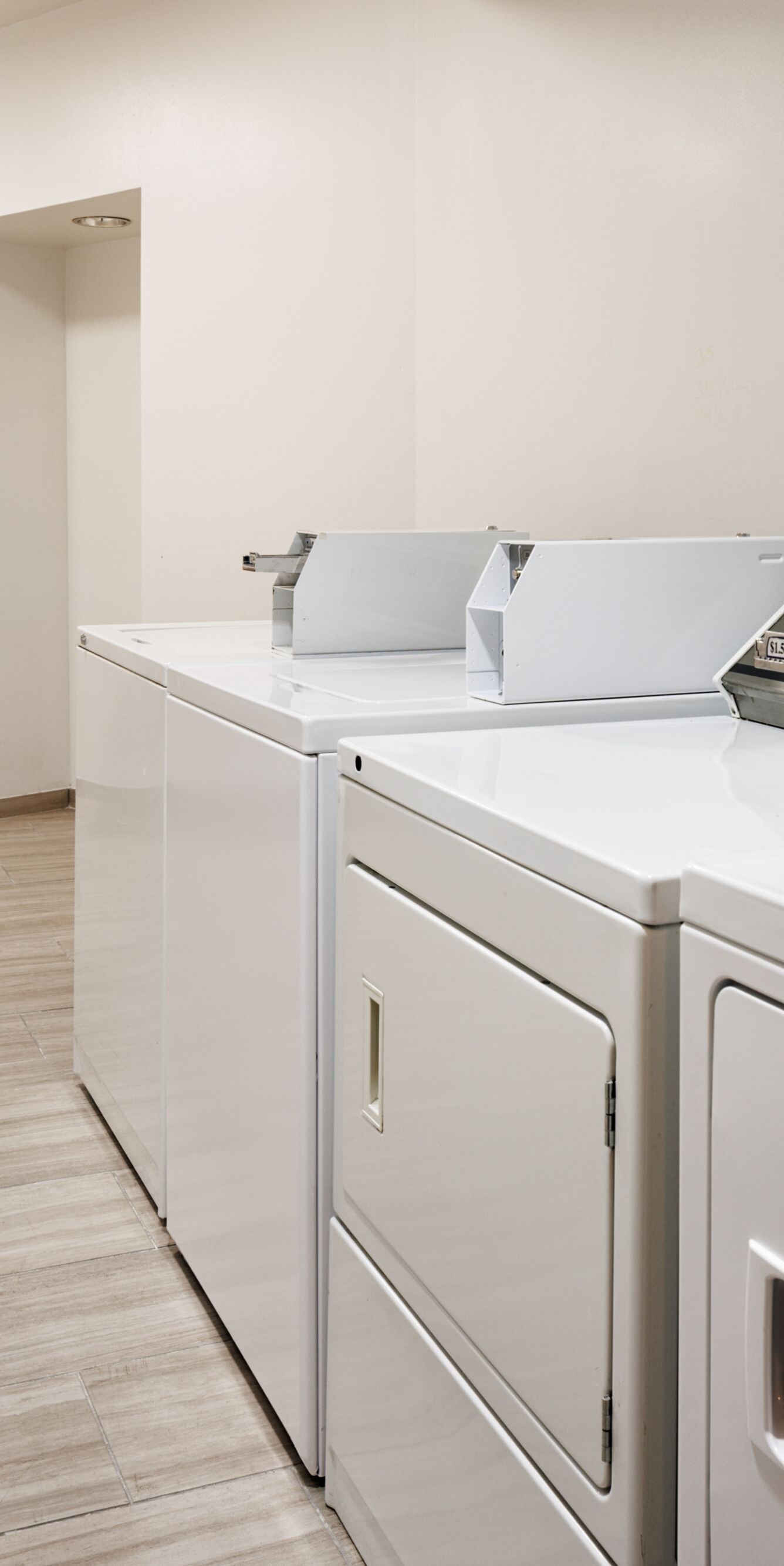 Laundry room with washers and dryers