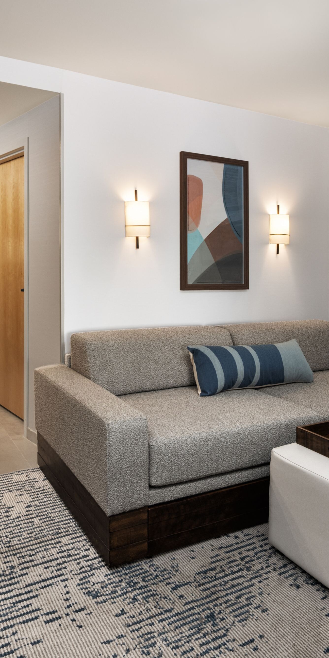 Suite living area with sofa and ottoman