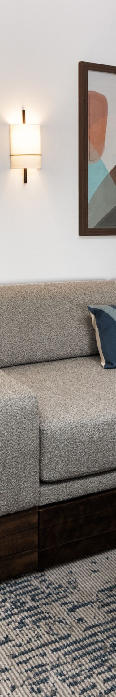 Suite living area with sofa and ottoman