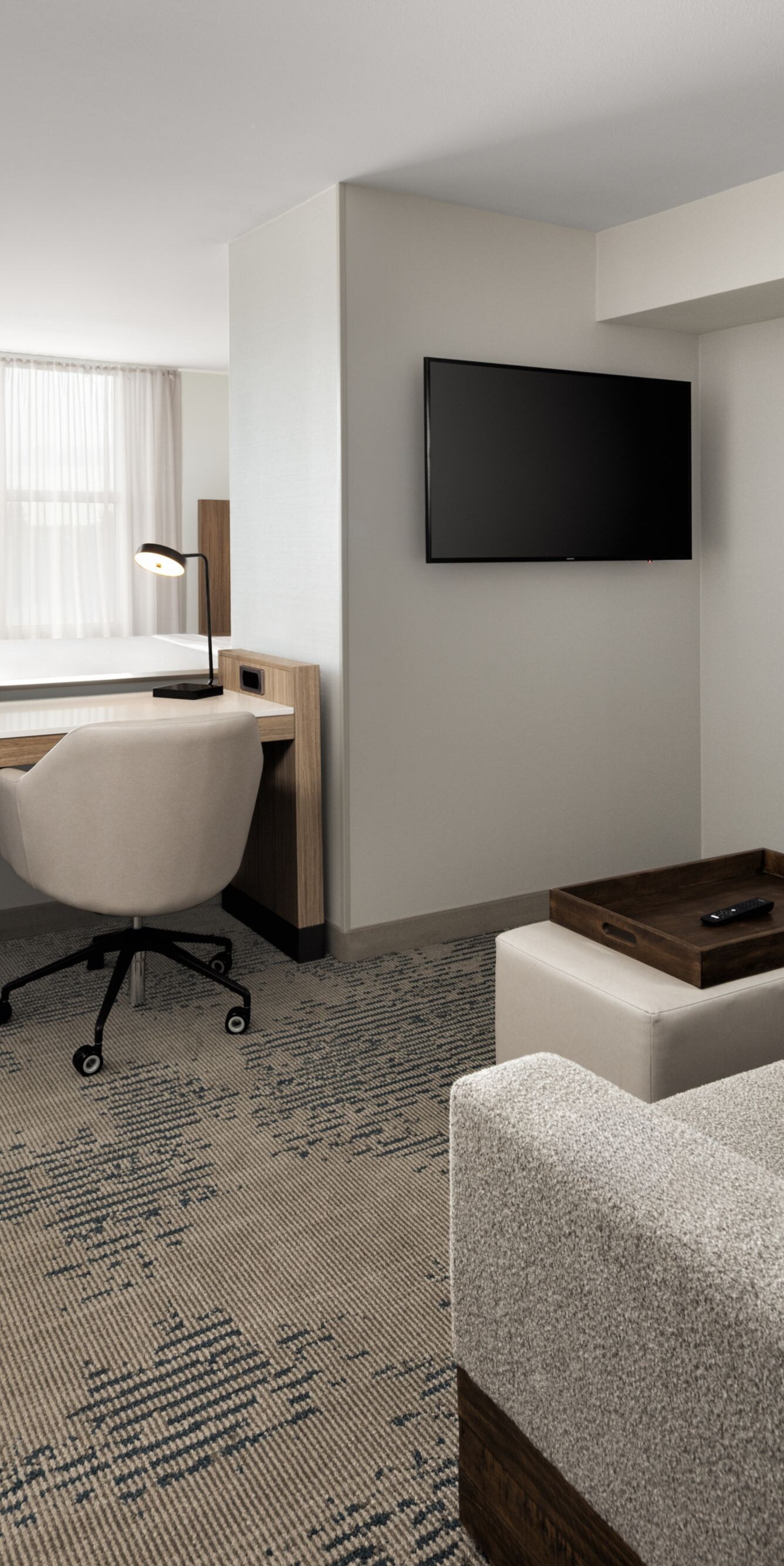 Suite with sofa, work desk, and king bed
