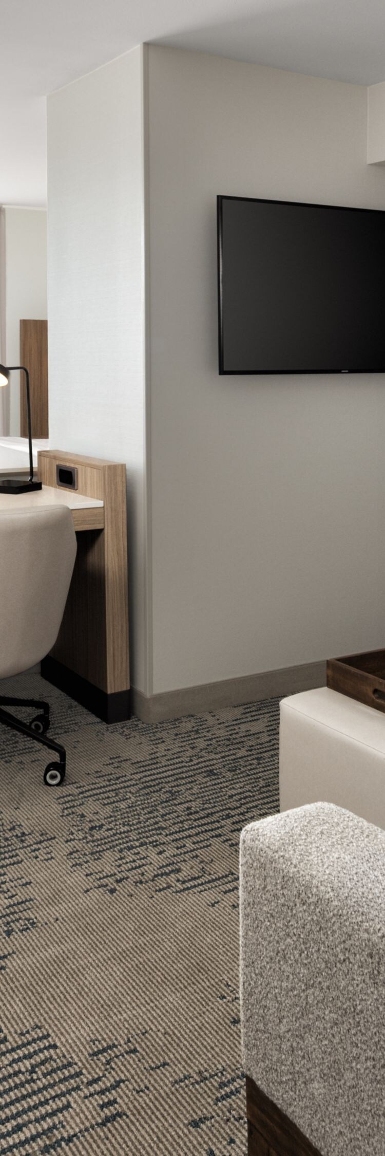 Suite with sofa, work desk, and king bed