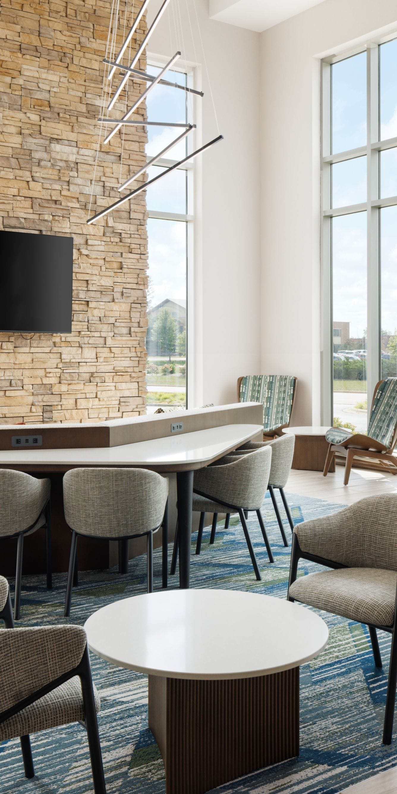Lobby lounge with stone wall and seating