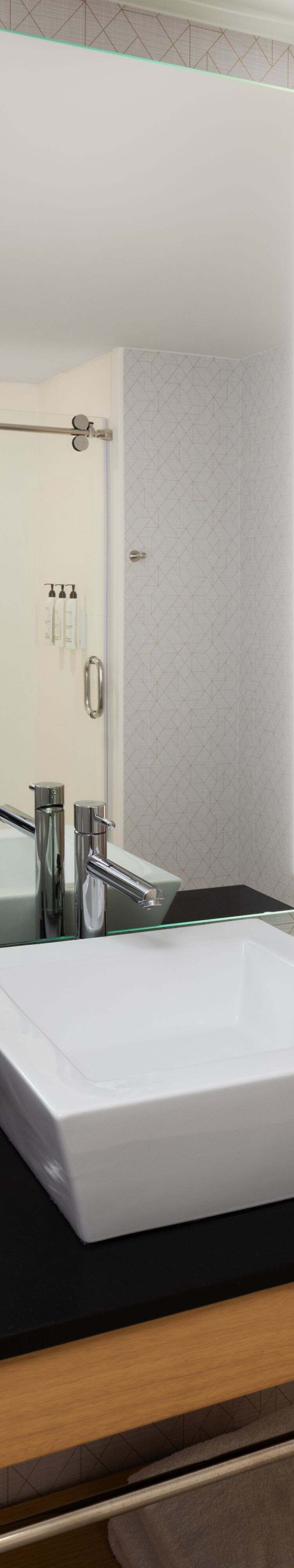 Modern bathroom with vessel sink and mirror