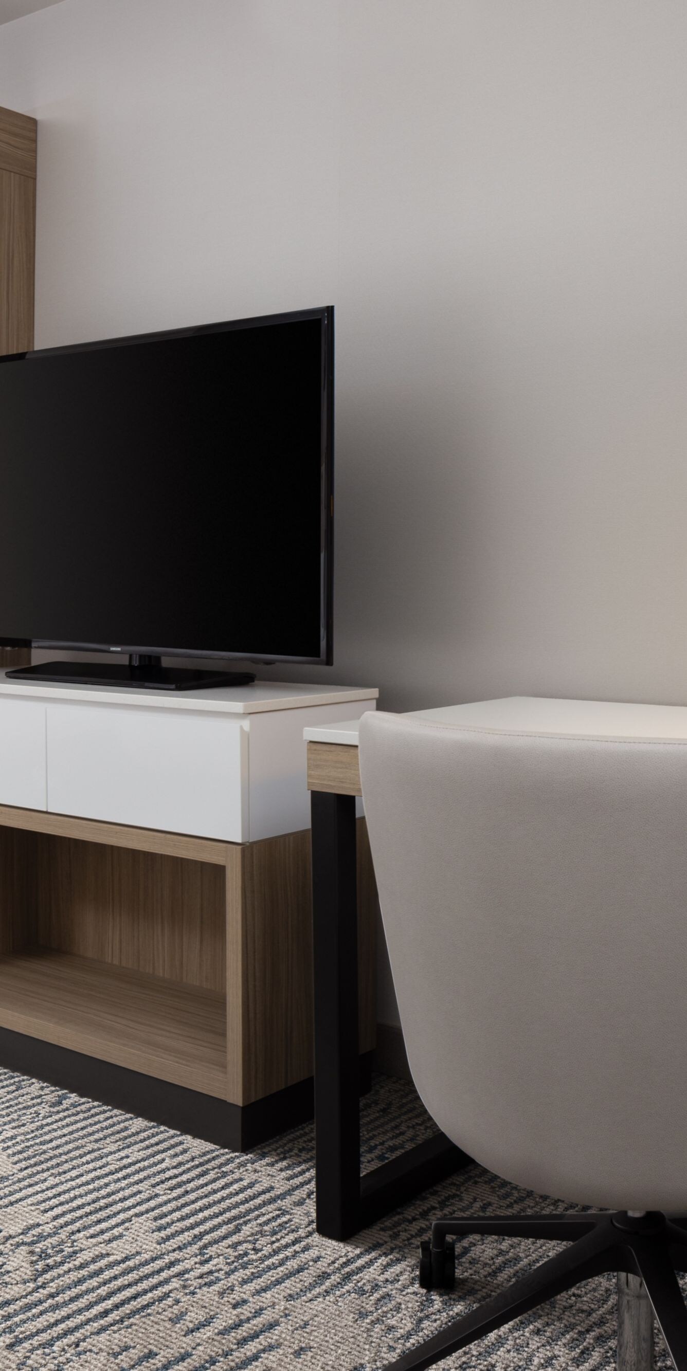 Guest room with work desk and wardrobe