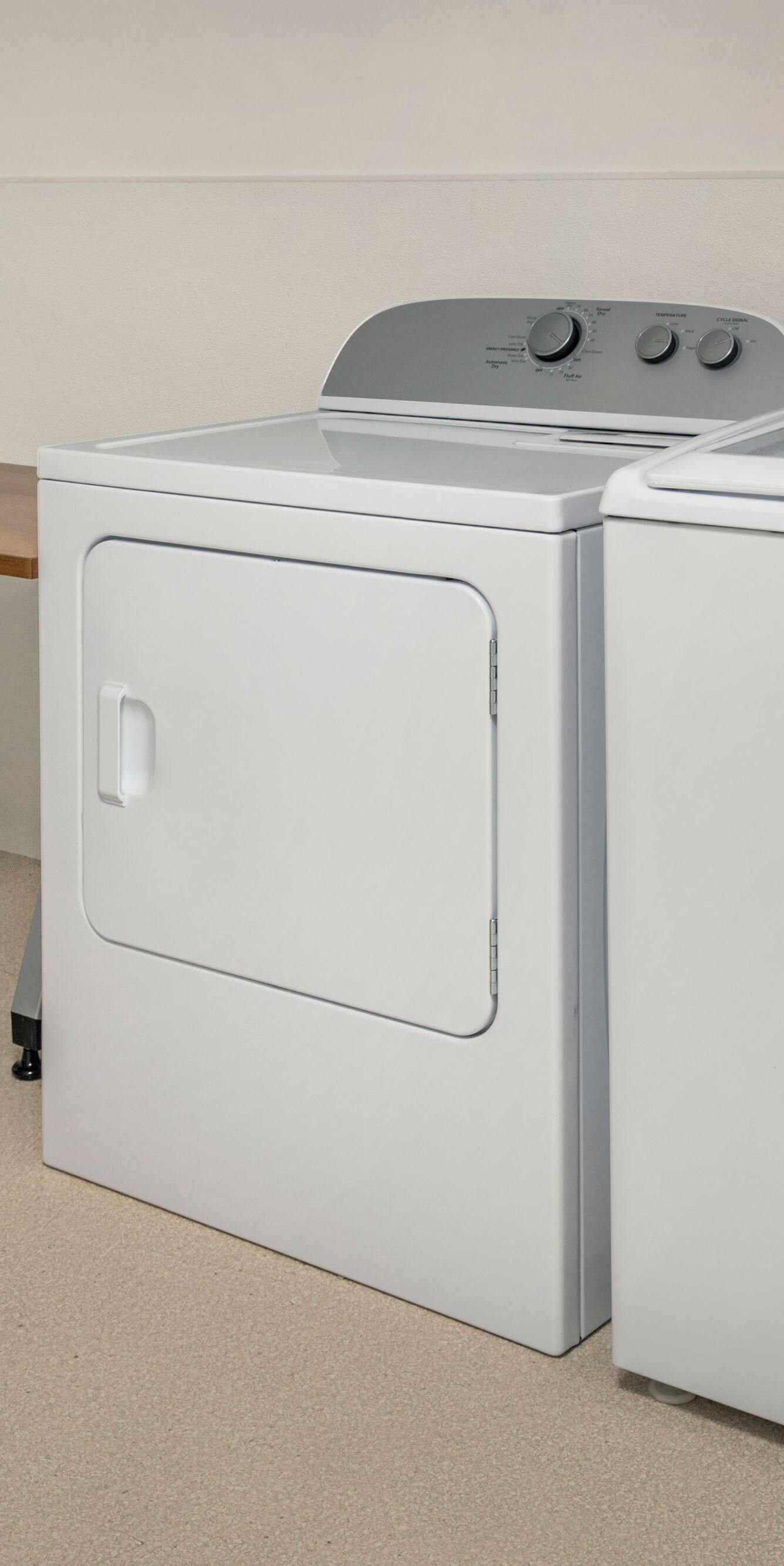 Laundry room with washer, dryer, folding table