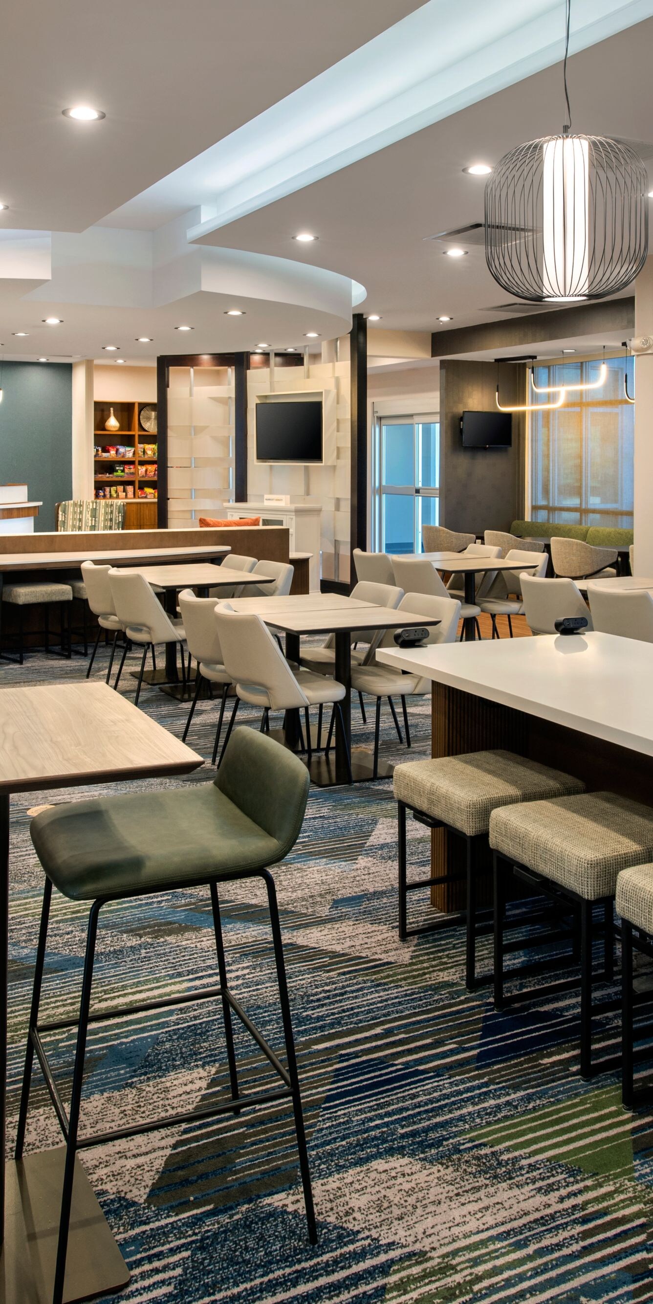Lobby with tables, chairs, communal seating