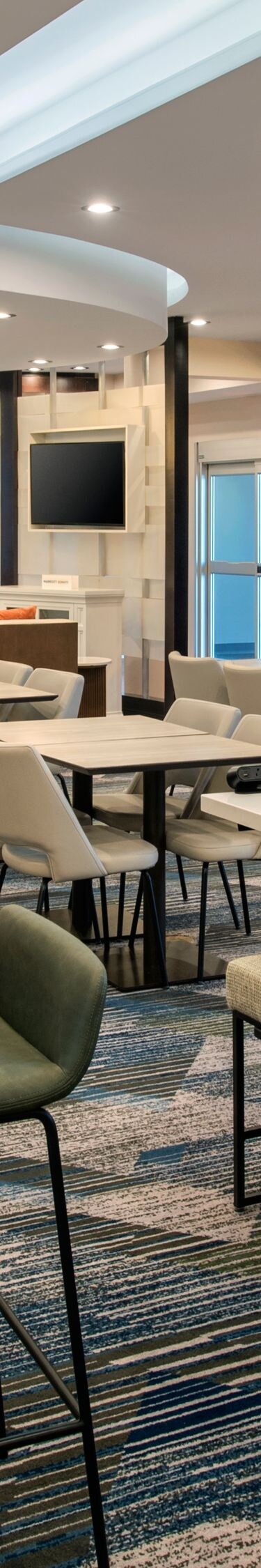 Lobby with tables, chairs, communal seating