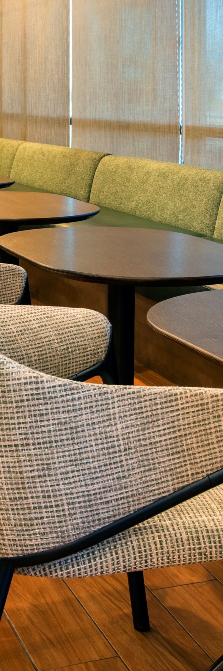 Seating area with cushioned bench seating, chairs