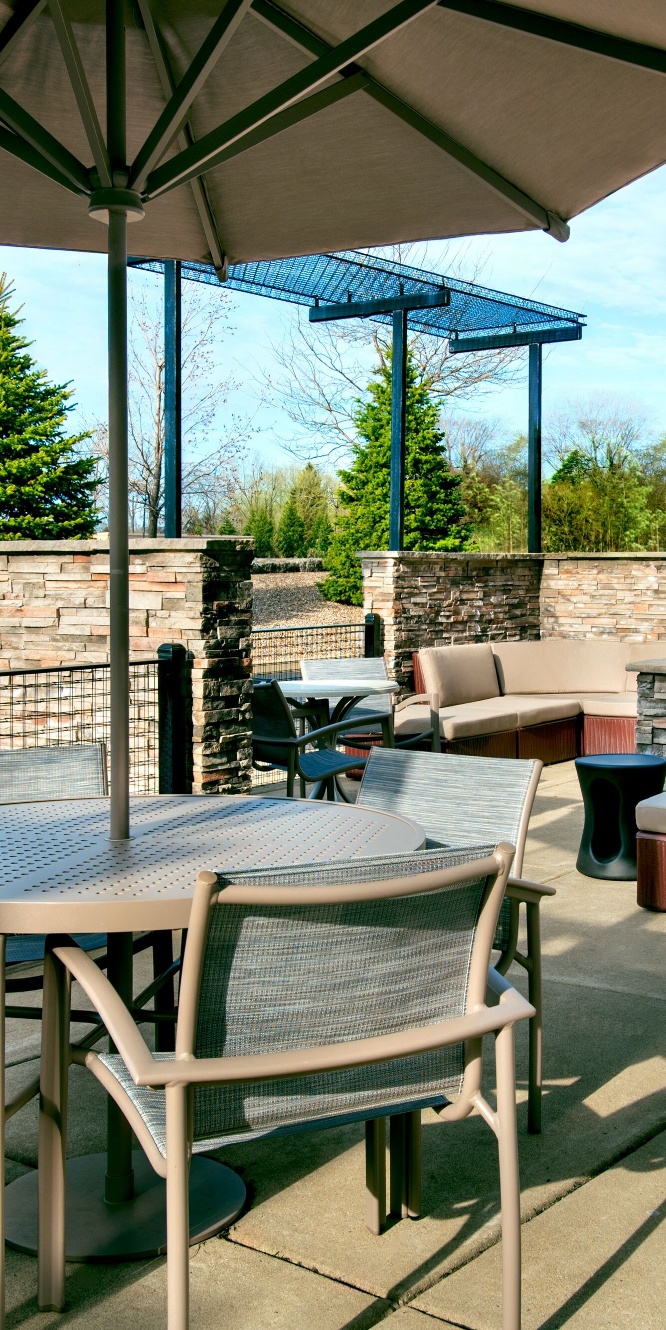 Outdoor patio with tables, chairs, covered seating