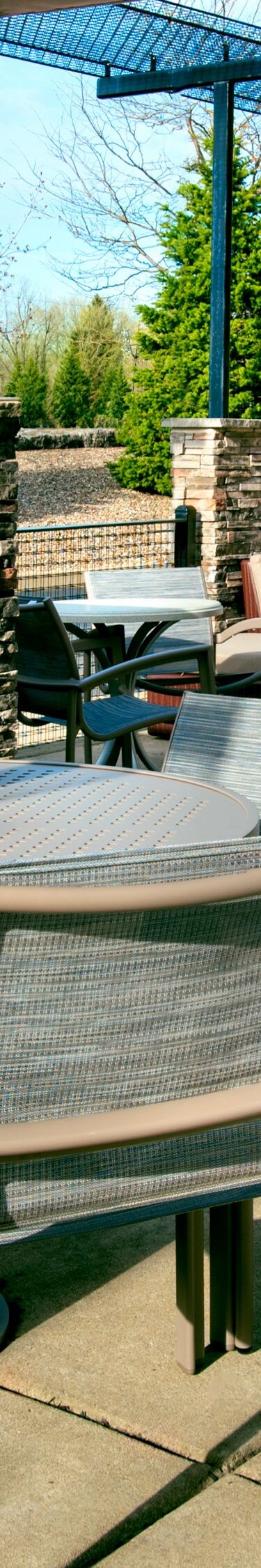 Outdoor patio with tables, chairs, covered seating