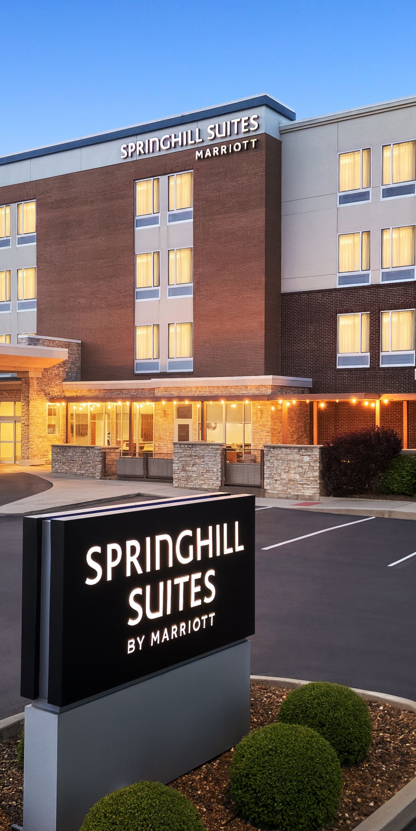 Exterior entrance and parking lot in the evening