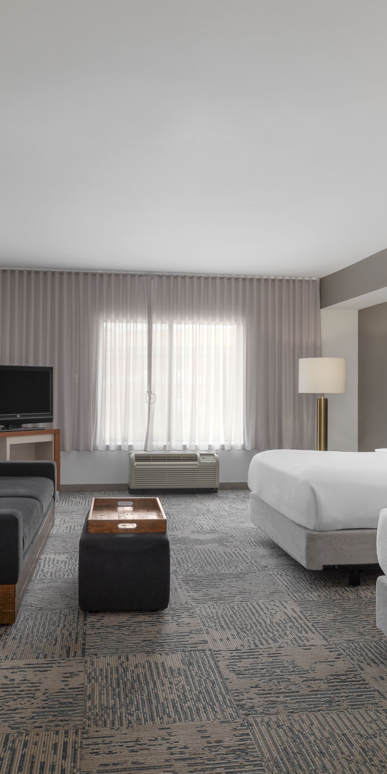 Accessible suite with two beds and sofa