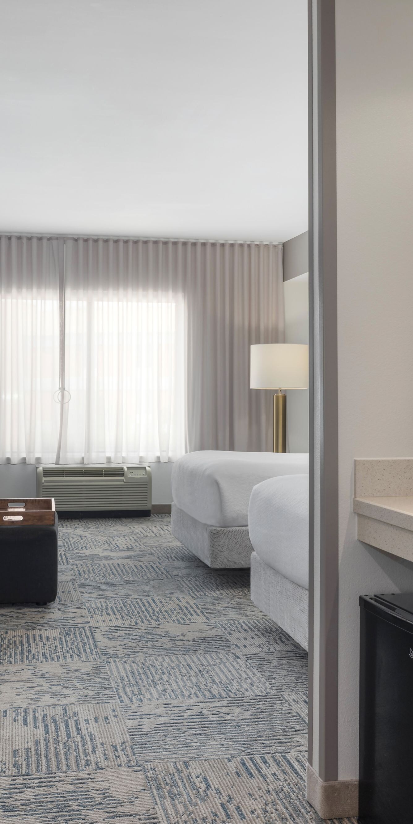Accessible suite with two beds and kitchenette