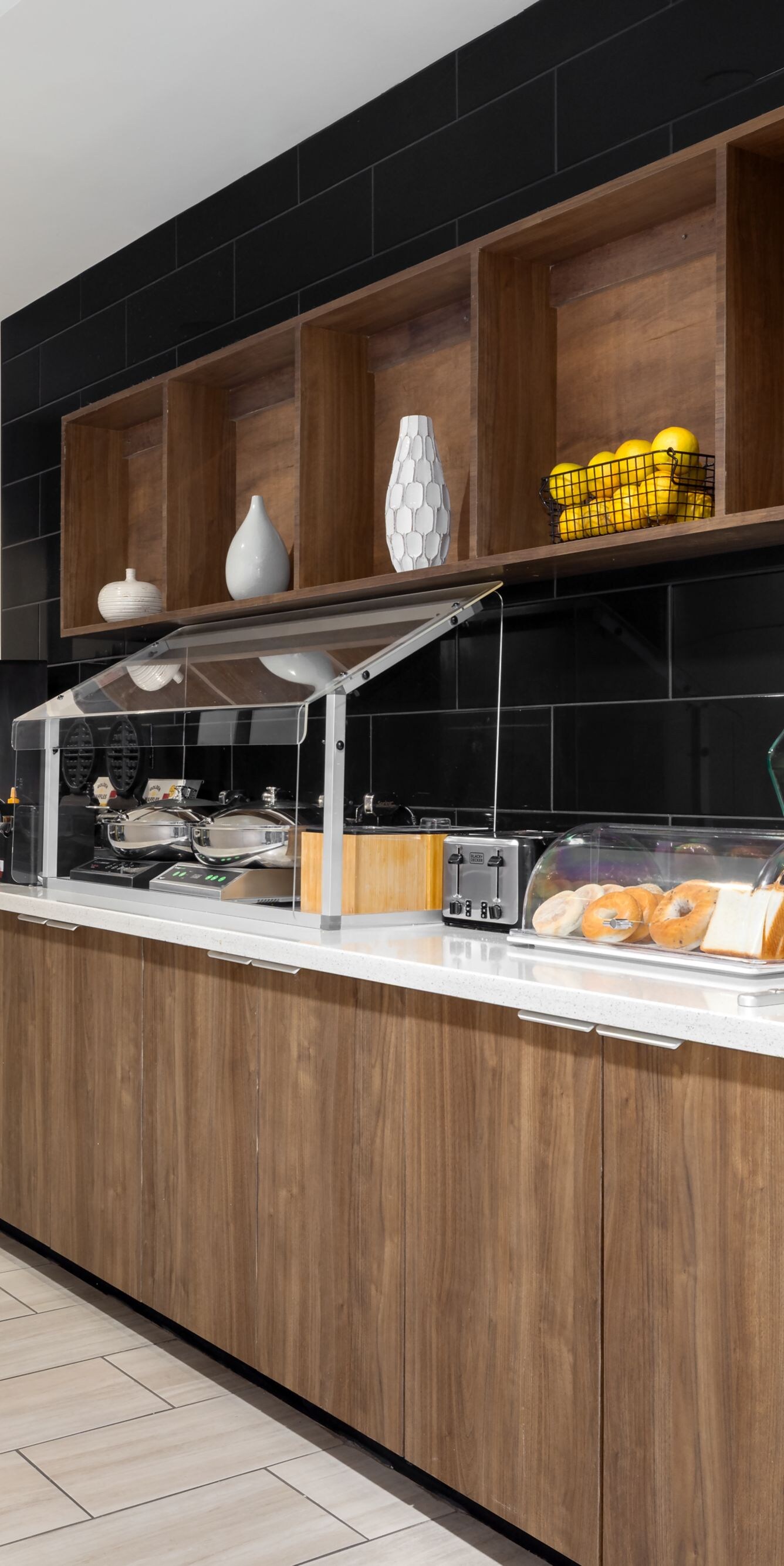 Breakfast buffet with fruit, cereal, and pastries