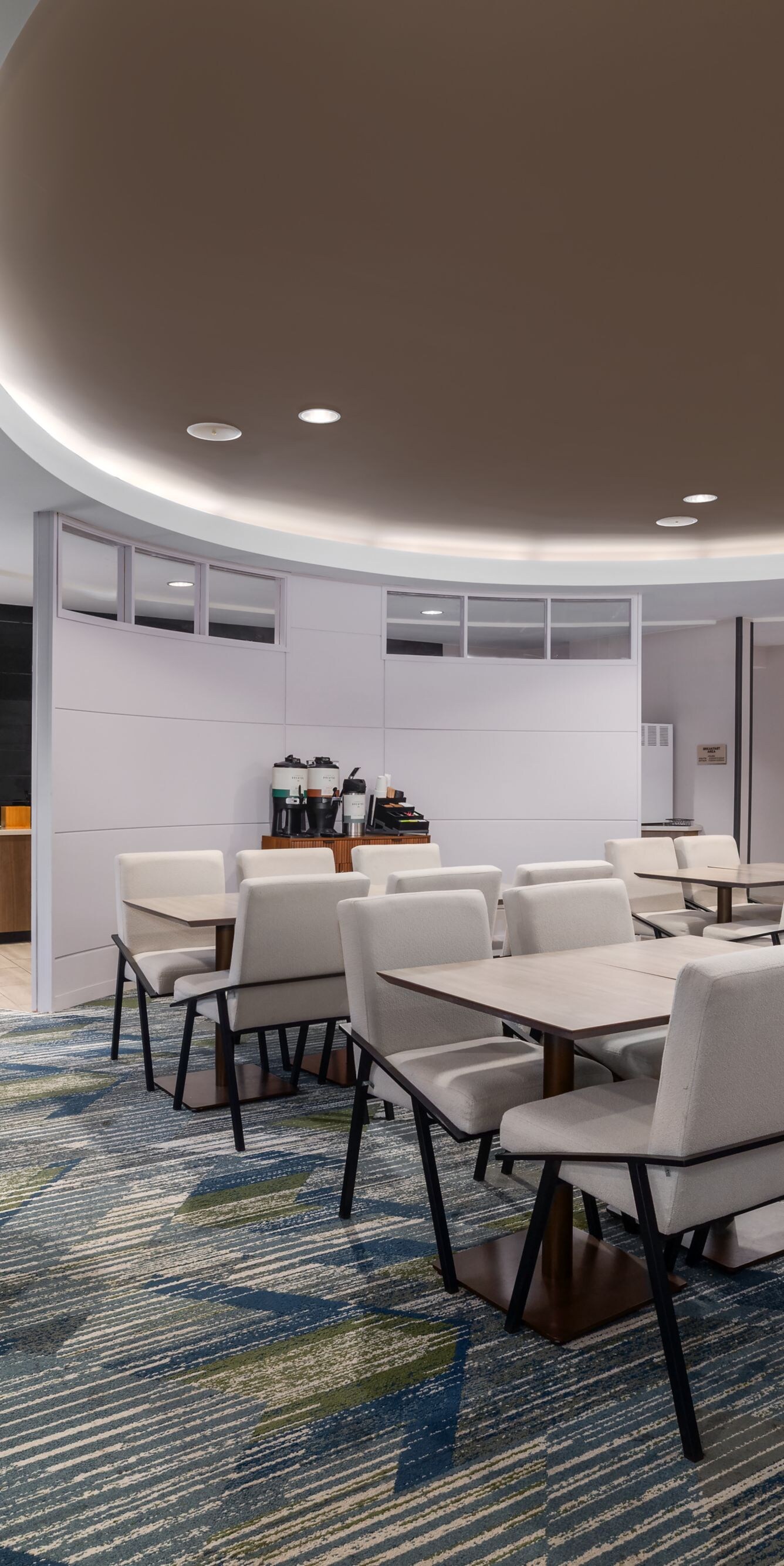 Dining area with tables, chairs, and seating
