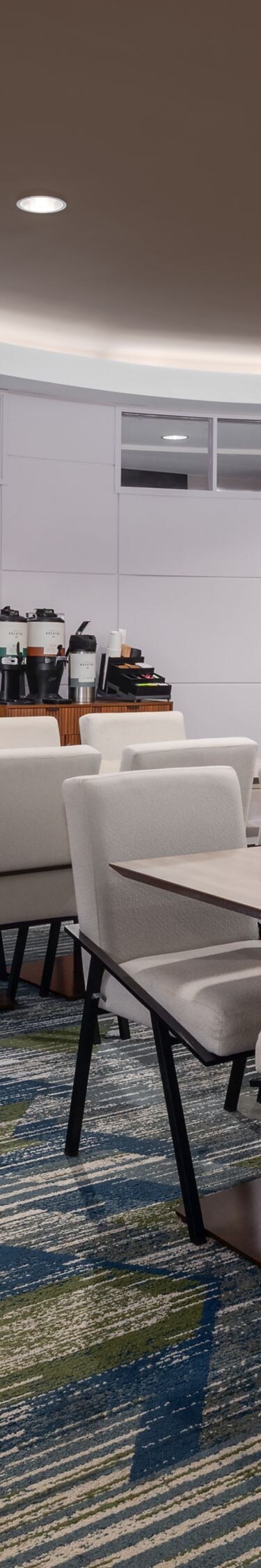 Dining area with tables, chairs, and seating
