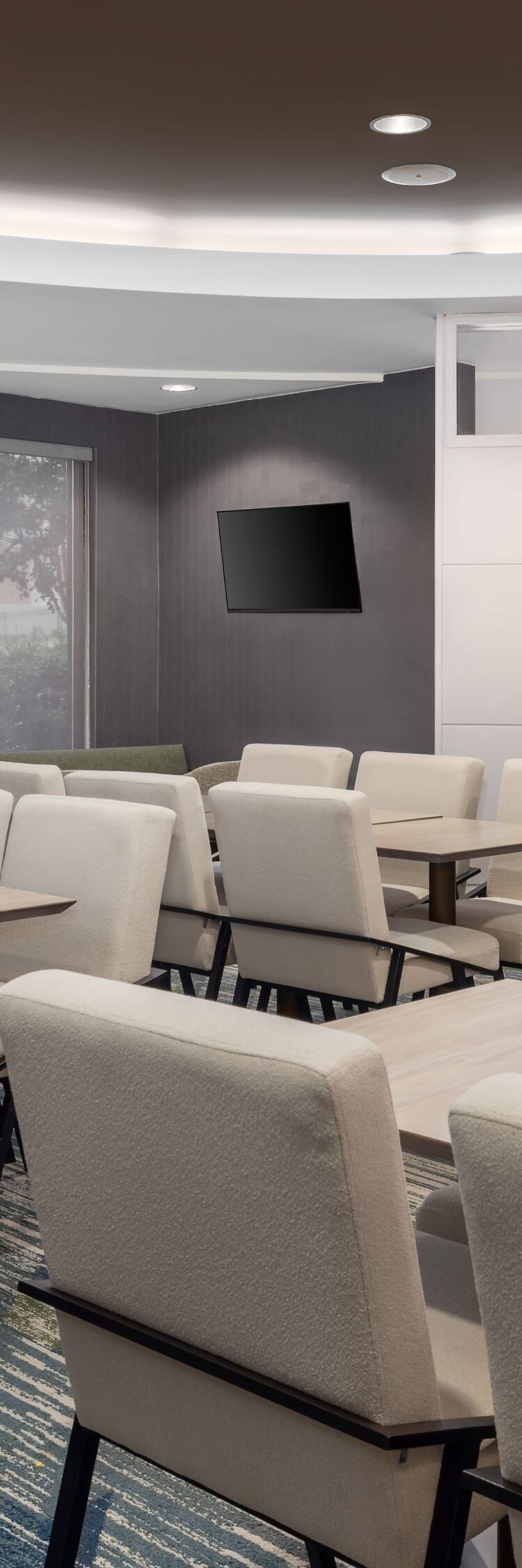 Dining area with tables, chairs and coffee station