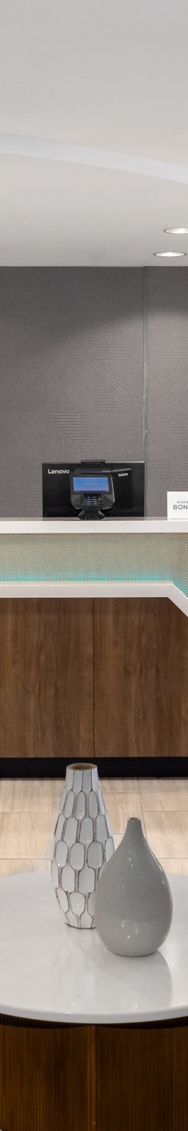 Front desk with seating area and market shelves