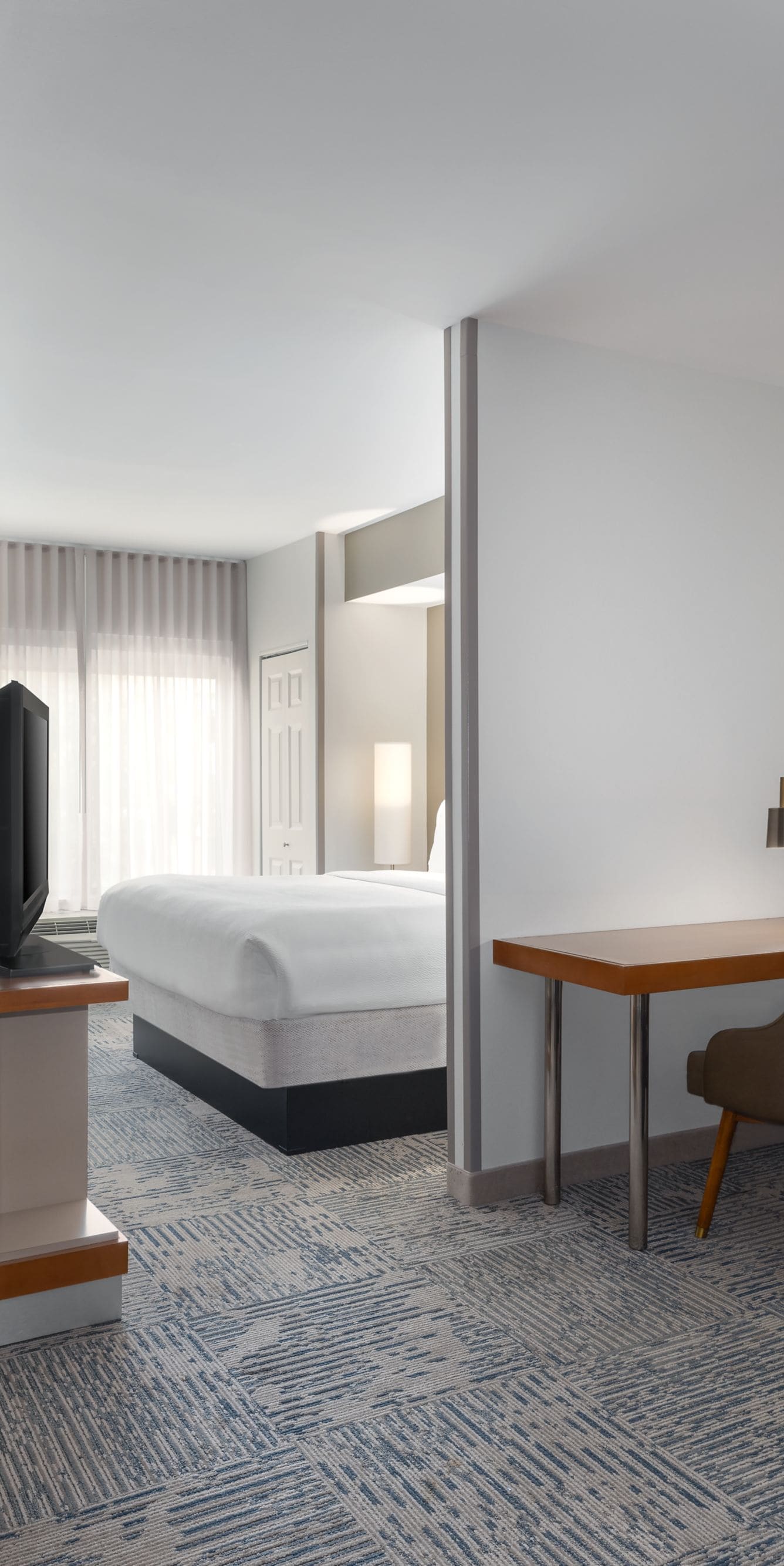 King suite with kitchenette, desk, and sofa