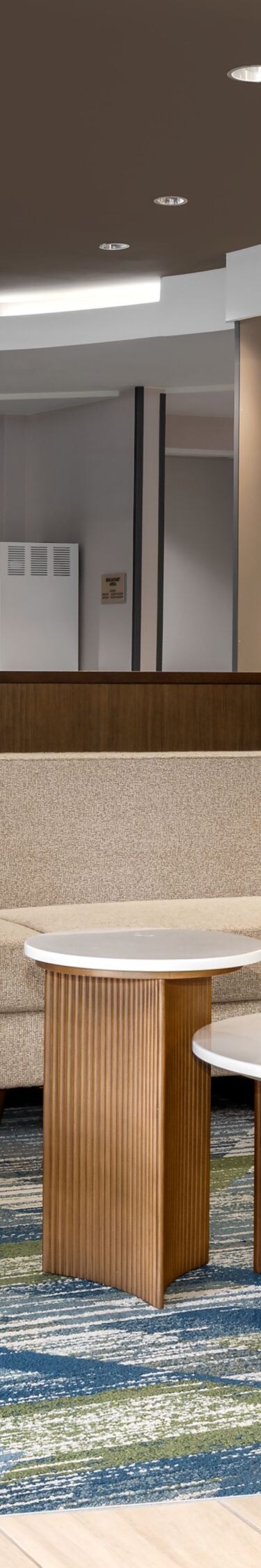 Lobby seating area with chairs and tables