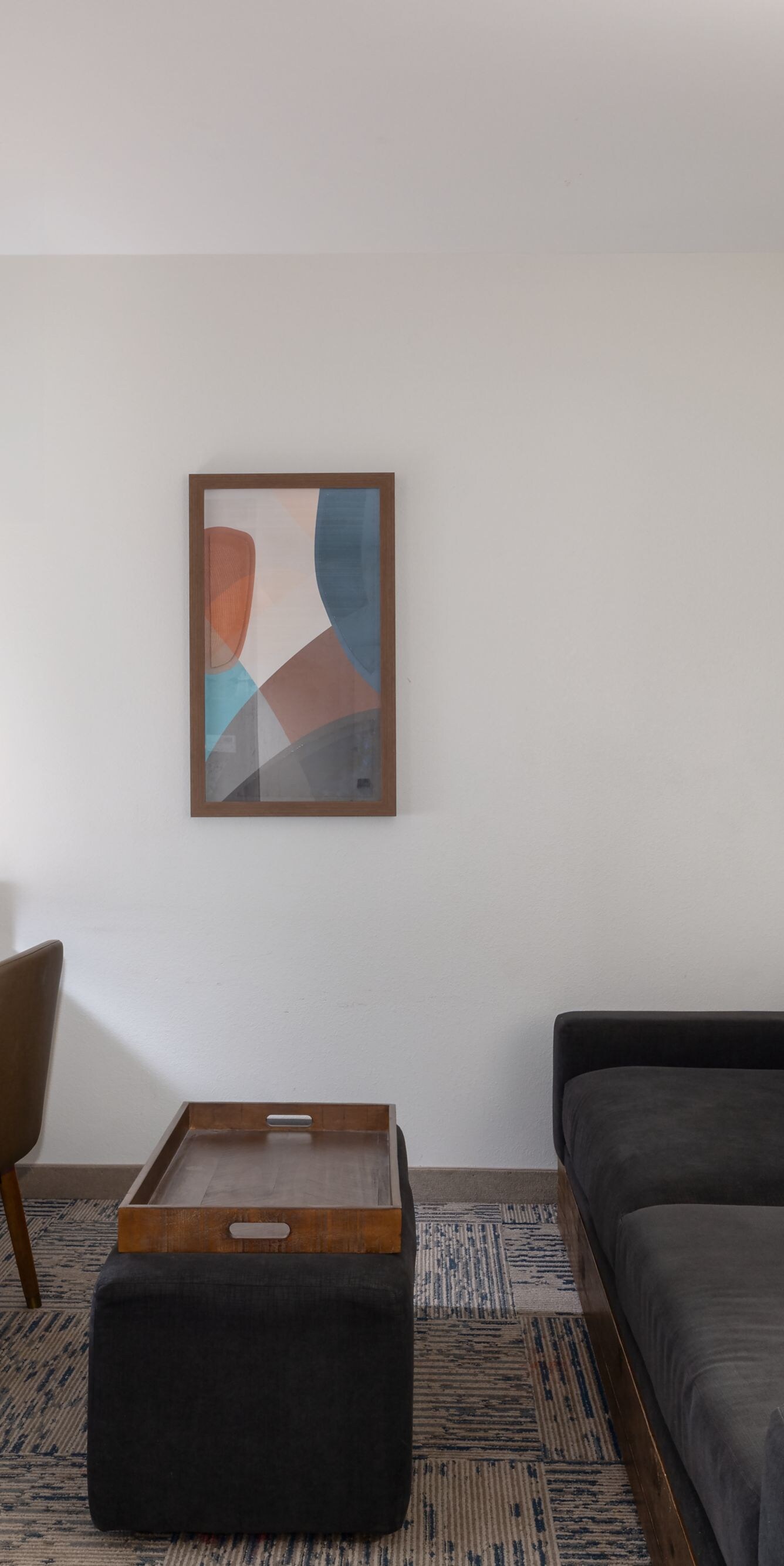 Suite living area with sofa, desk, and table
