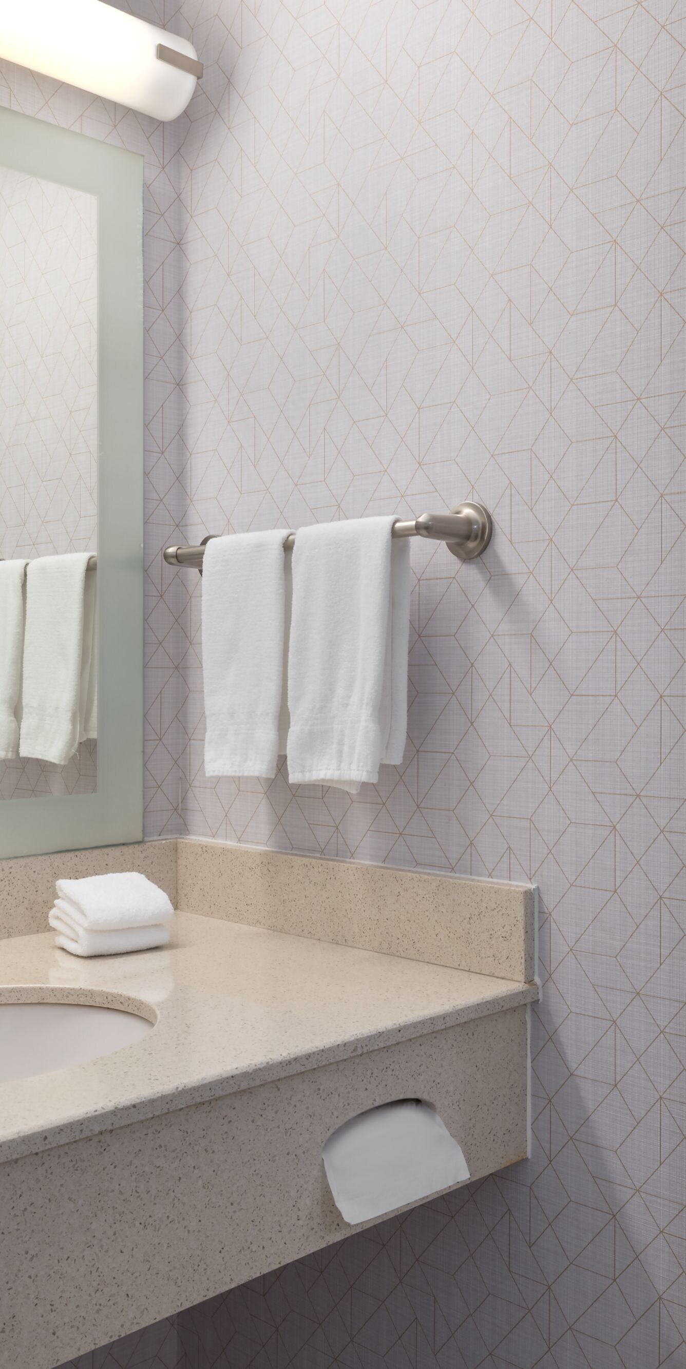 Bathroom vanity with mirror and towels