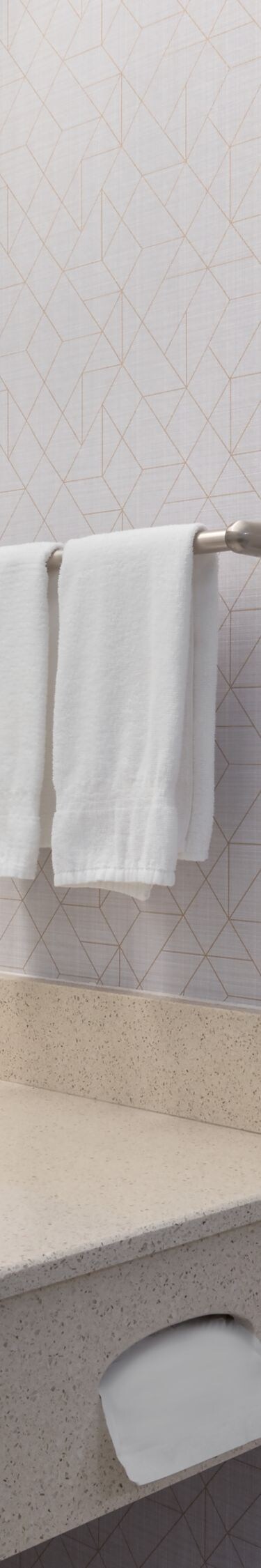 Bathroom vanity with mirror and towels