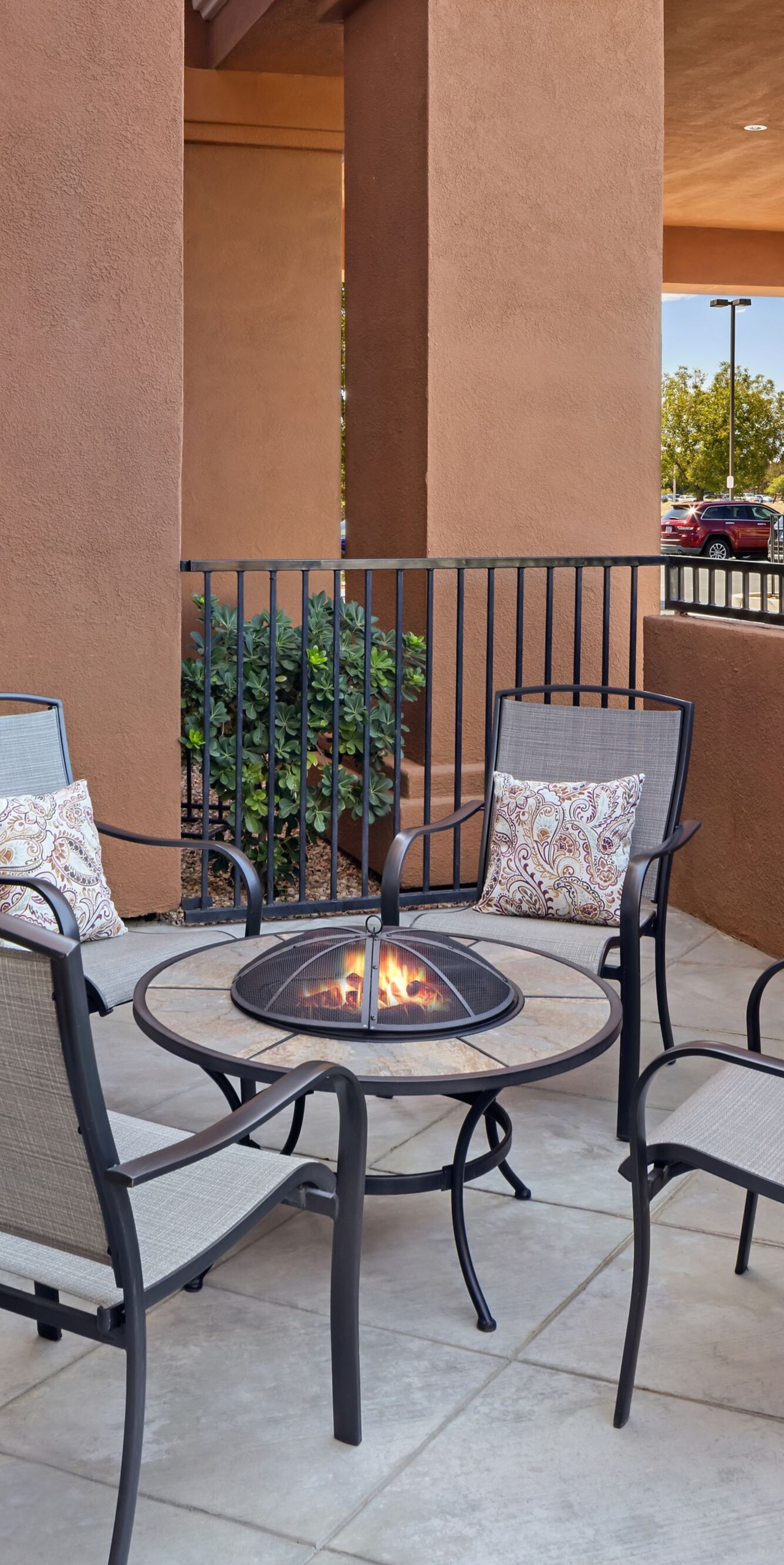 Outdoor seating area with chairs around fire pit