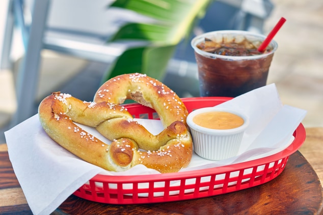 soft pretzel and beer cheese with soft drink