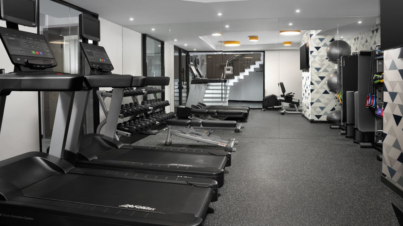 Fitness center with machines and equipment.