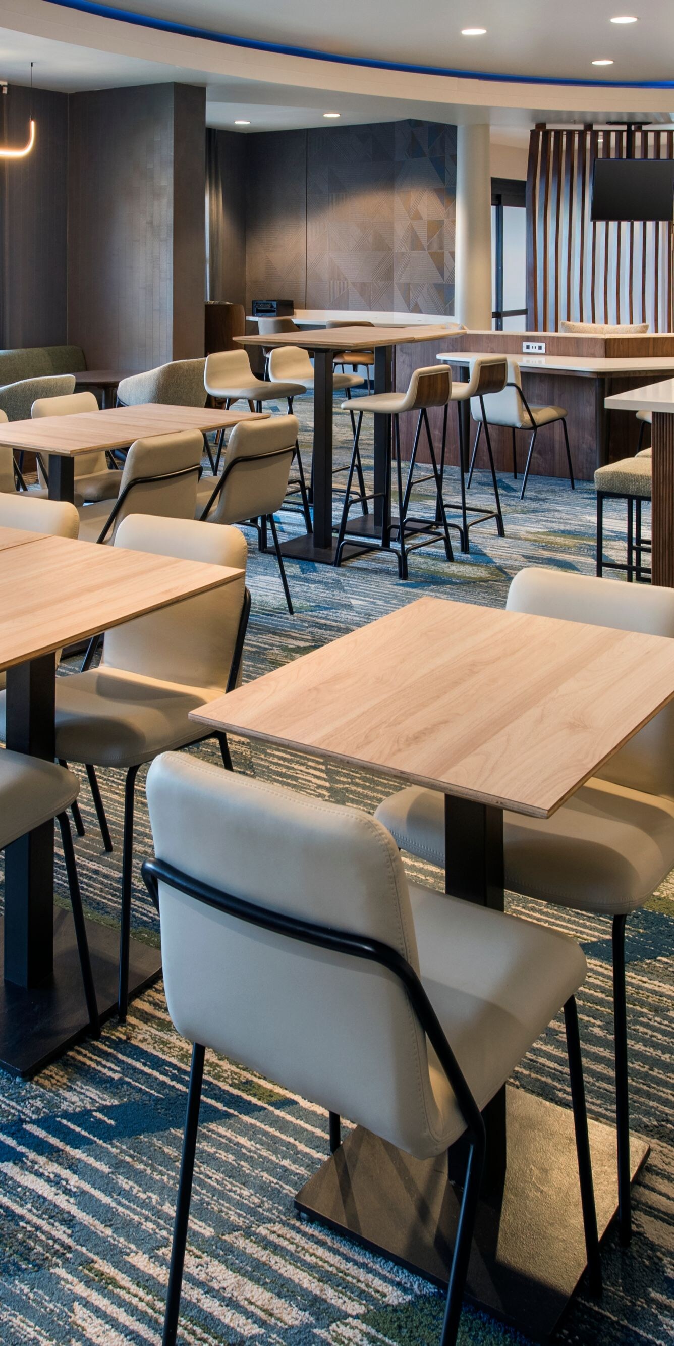 Modern dining area with tables and chairs