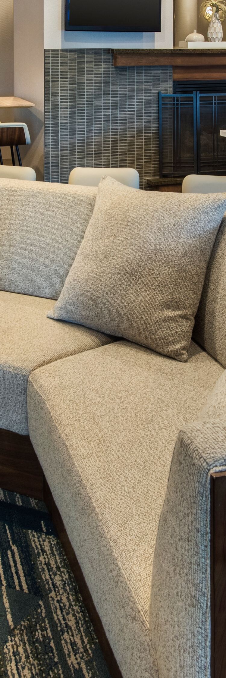 Lobby lounge with sectional and fireplace
