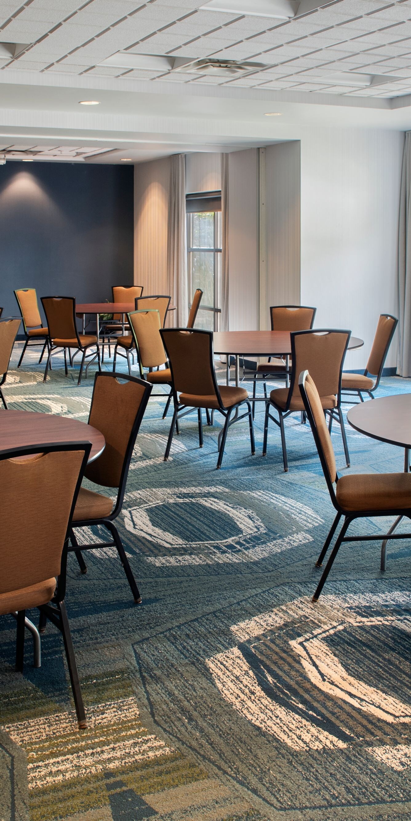 Meeting space with round tables and chairs